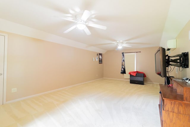 workout room featuring light colored carpet, vaulted ceiling, and ceiling fan