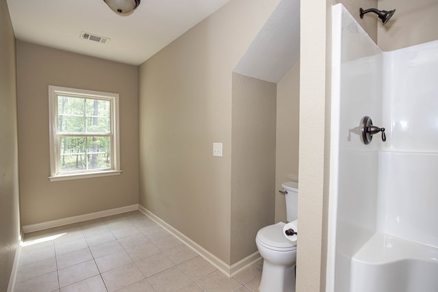 full bathroom with a shower, toilet, tile patterned floors, and visible vents