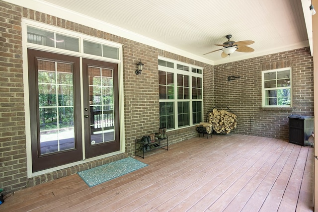 wooden deck with a ceiling fan