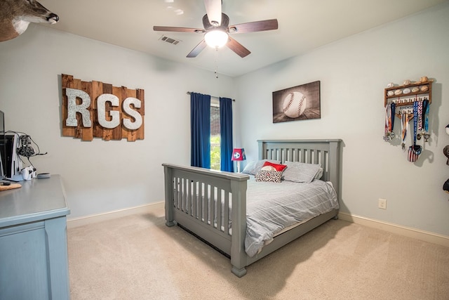 bedroom featuring light carpet, baseboards, visible vents, and a ceiling fan