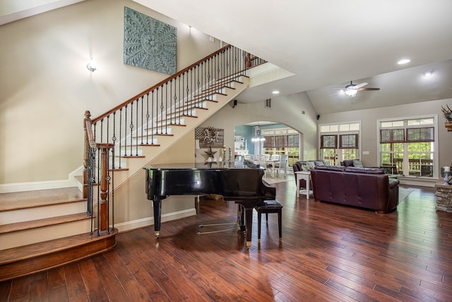 interior space with stairway, arched walkways, ceiling fan, and wood-type flooring