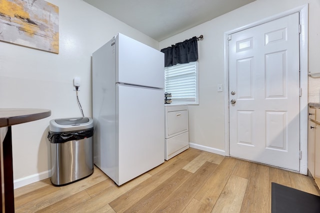 laundry room featuring washer / dryer and light hardwood / wood-style floors