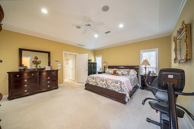 bedroom with light colored carpet, vaulted ceiling, ceiling fan, and crown molding