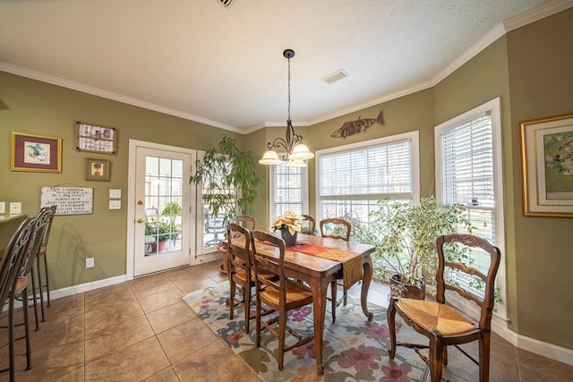 dining room featuring tile patterned flooring, a notable chandelier, ornamental molding, and a textured ceiling