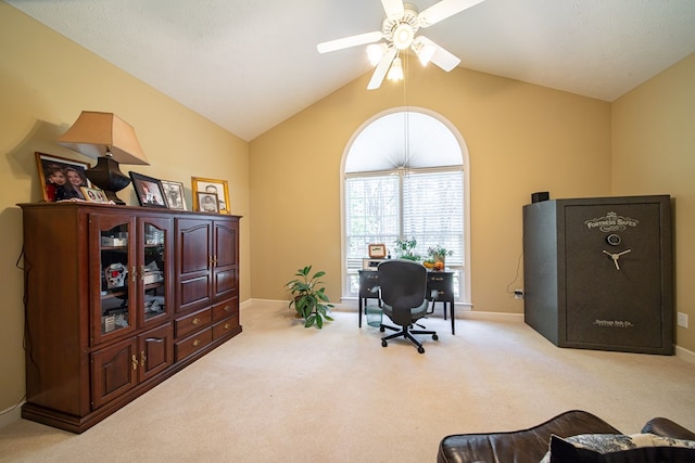 carpeted office space featuring ceiling fan and lofted ceiling