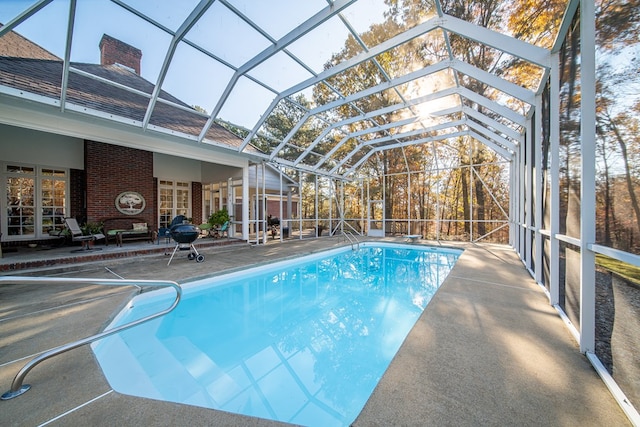 view of pool featuring a patio and a lanai