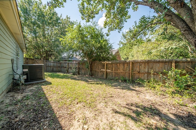 view of yard featuring central air condition unit