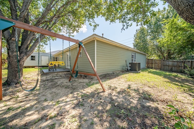 back of property featuring cooling unit