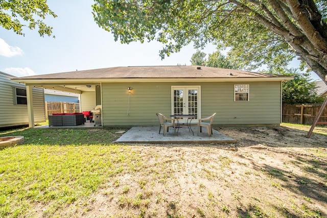 back of house featuring french doors, an outdoor hangout area, ceiling fan, a yard, and a patio area