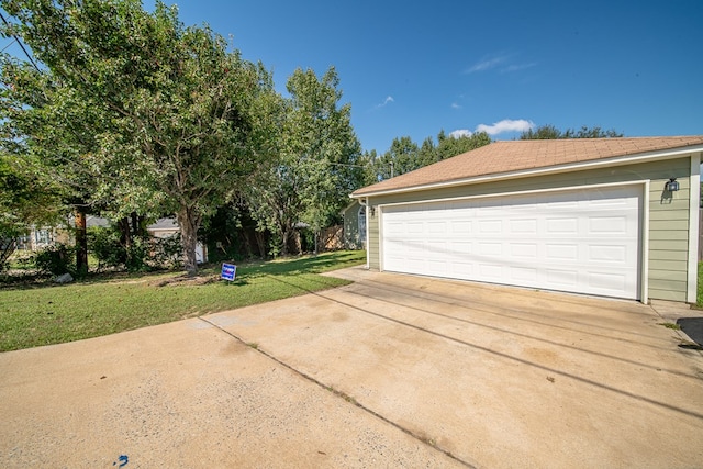 garage with a lawn