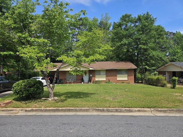 single story home featuring brick siding and a front lawn