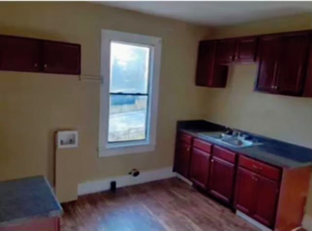 kitchen with light hardwood / wood-style floors and sink