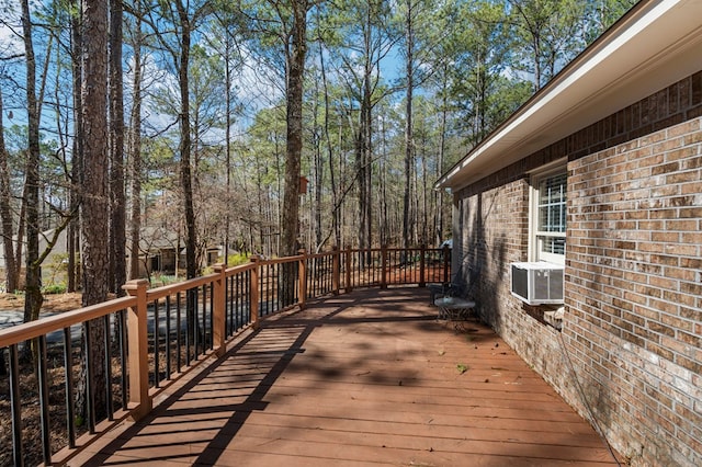 wooden terrace featuring cooling unit