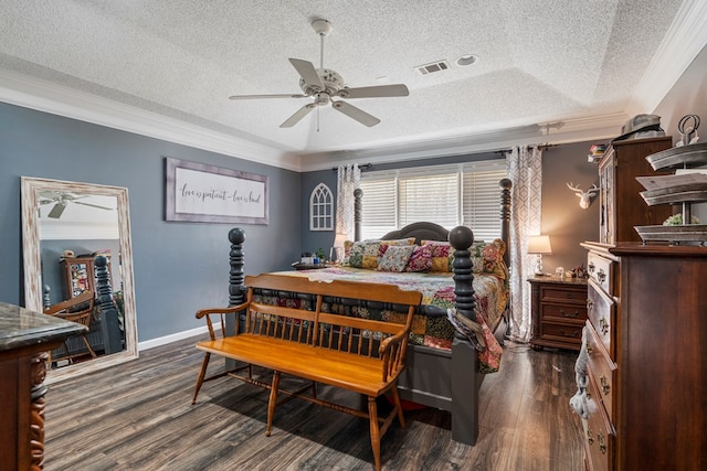 bedroom featuring visible vents, crown molding, baseboards, and wood finished floors