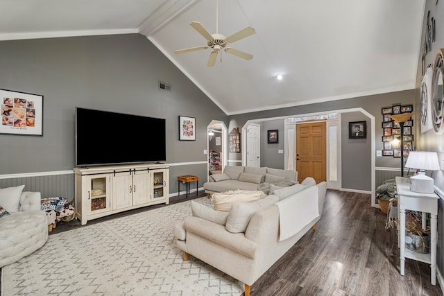 living room featuring a ceiling fan, wood finished floors, high vaulted ceiling, arched walkways, and ornamental molding