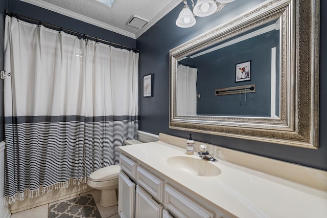 bathroom with crown molding, toilet, vanity, tile patterned floors, and a textured ceiling