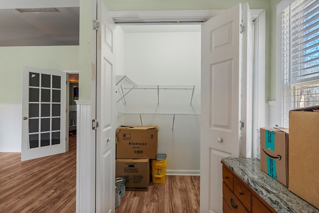 spacious closet with wood finished floors