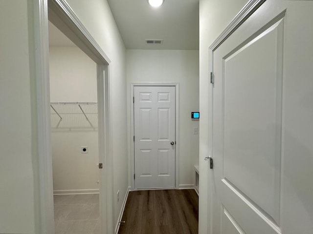 corridor with dark wood-type flooring