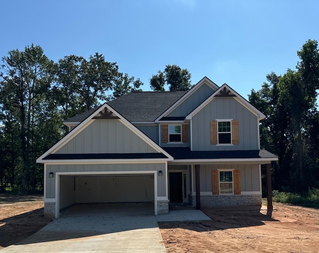 craftsman-style home with a porch and a garage