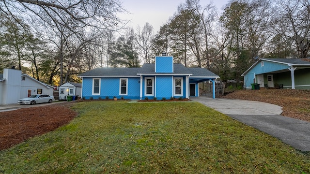 ranch-style house with a front lawn and a carport