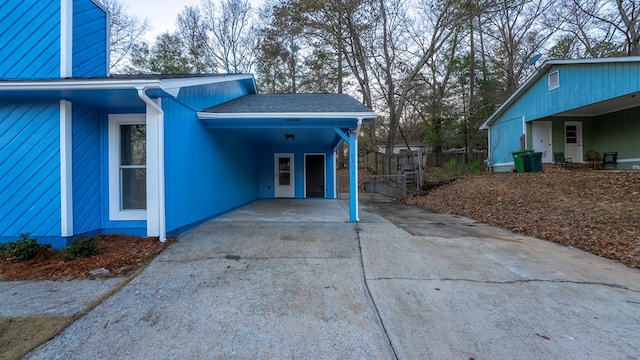 view of side of home featuring a carport