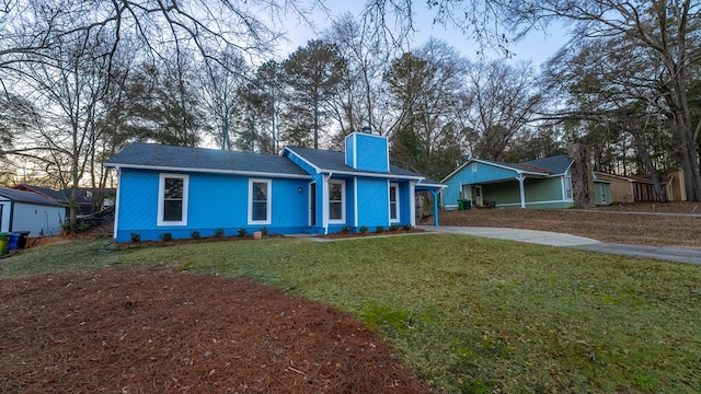 ranch-style house with a front yard