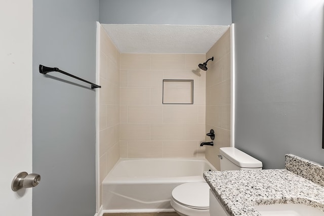 full bathroom with vanity, toilet, and tiled shower / bath