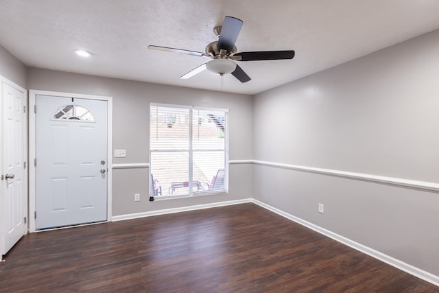 foyer with dark wood-type flooring and ceiling fan