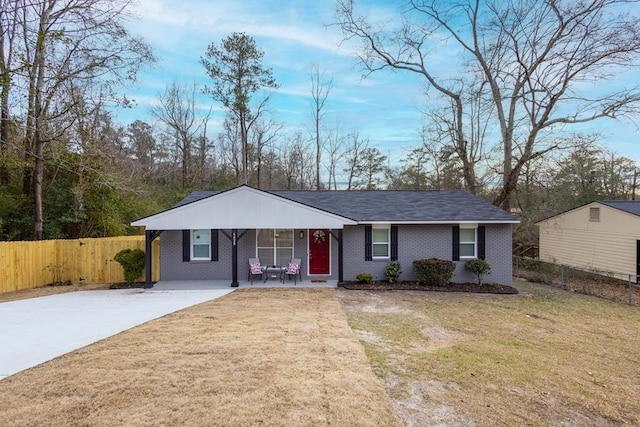 ranch-style house with a front lawn and covered porch