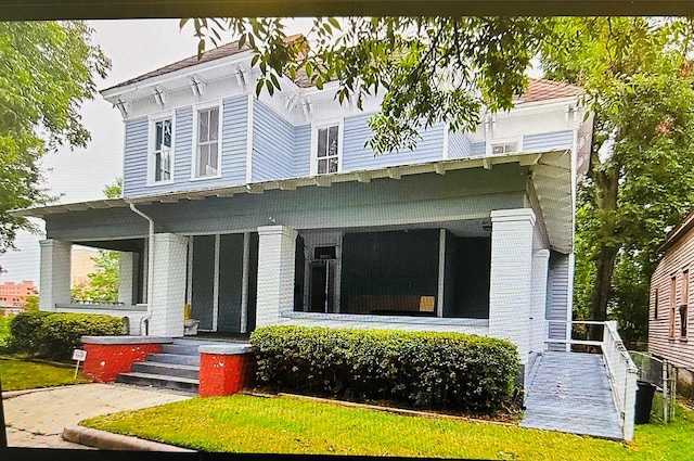 rear view of house with a porch