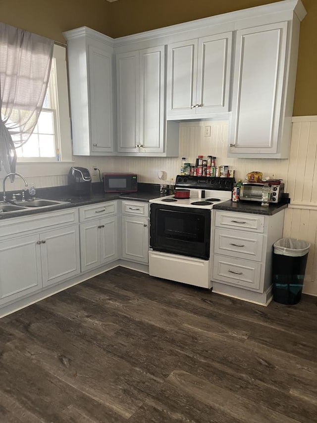 kitchen featuring white cabinets, dark hardwood / wood-style floors, white range with electric cooktop, and sink