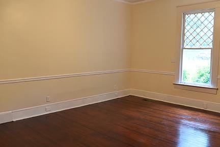 unfurnished room featuring dark hardwood / wood-style flooring