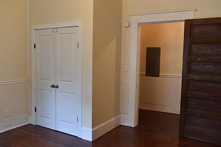 hall featuring dark wood-type flooring