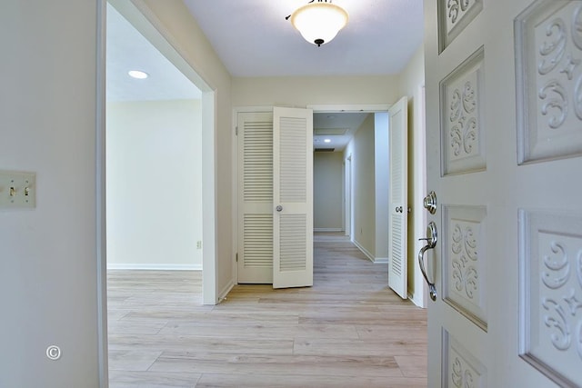 hallway featuring light hardwood / wood-style flooring