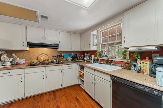 kitchen featuring white cabinets, sink, light hardwood / wood-style flooring, and black appliances