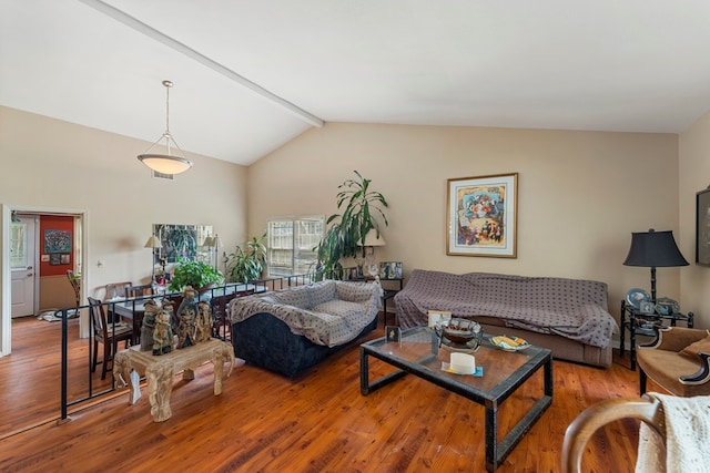 living room with lofted ceiling with beams and wood-type flooring