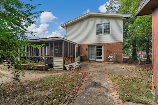 back of property featuring a sunroom