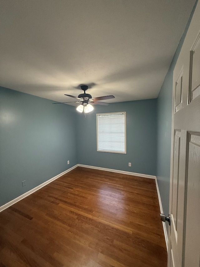 unfurnished room with wood-type flooring and ceiling fan