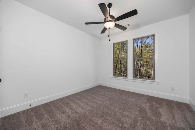 unfurnished room featuring carpet flooring and ceiling fan