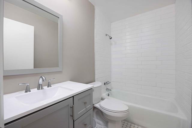 bathroom featuring toilet, vanity, and bathing tub / shower combination