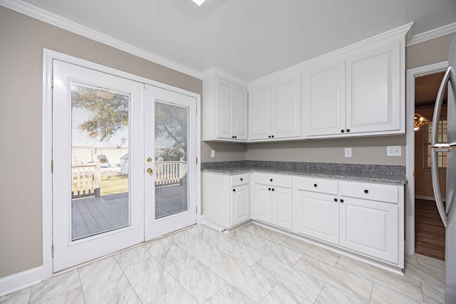 kitchen featuring a chandelier, ornamental molding, french doors, white cabinets, and marble finish floor