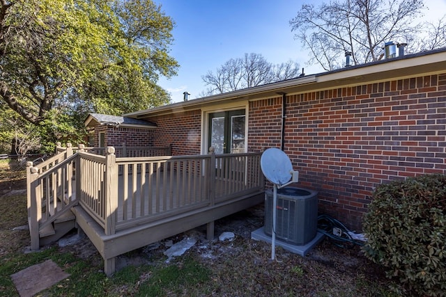 wooden deck featuring central AC unit