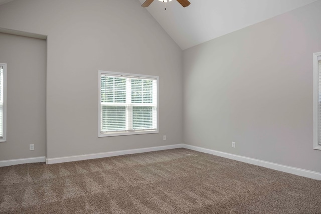 empty room with carpet, high vaulted ceiling, and ceiling fan