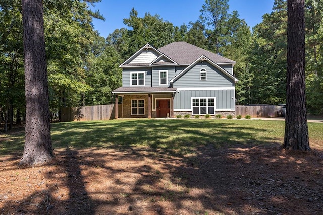 back of house featuring a yard