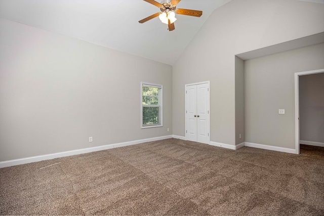 unfurnished bedroom featuring ceiling fan, carpet floors, high vaulted ceiling, and a closet