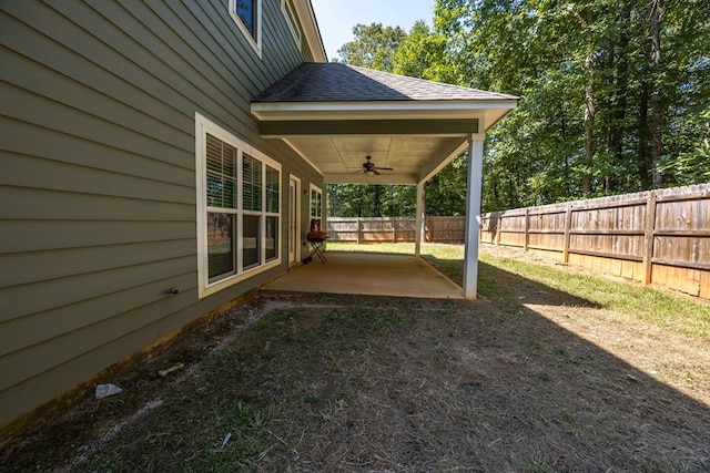 view of yard featuring ceiling fan and a patio area