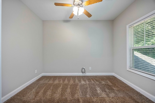 carpeted empty room featuring ceiling fan