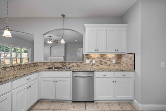 kitchen featuring white cabinets, tasteful backsplash, sink, decorative light fixtures, and dishwasher