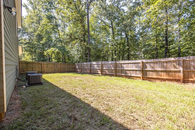 view of yard featuring central AC unit