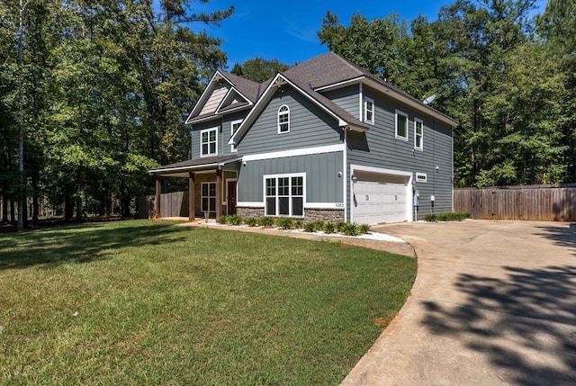 craftsman-style house with a front yard and a garage